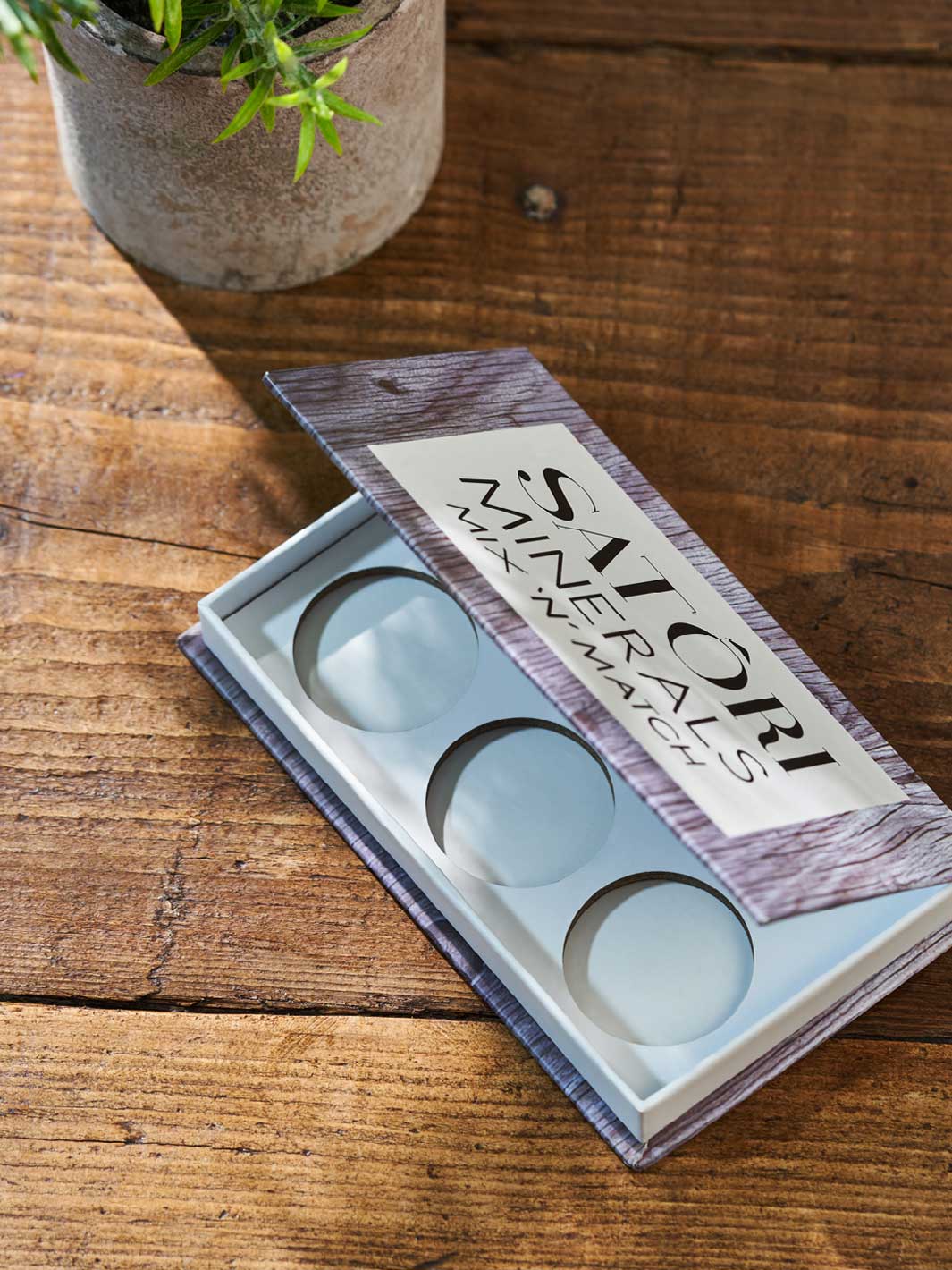 Luxury cardboard book box packaging with internal punch inserts.